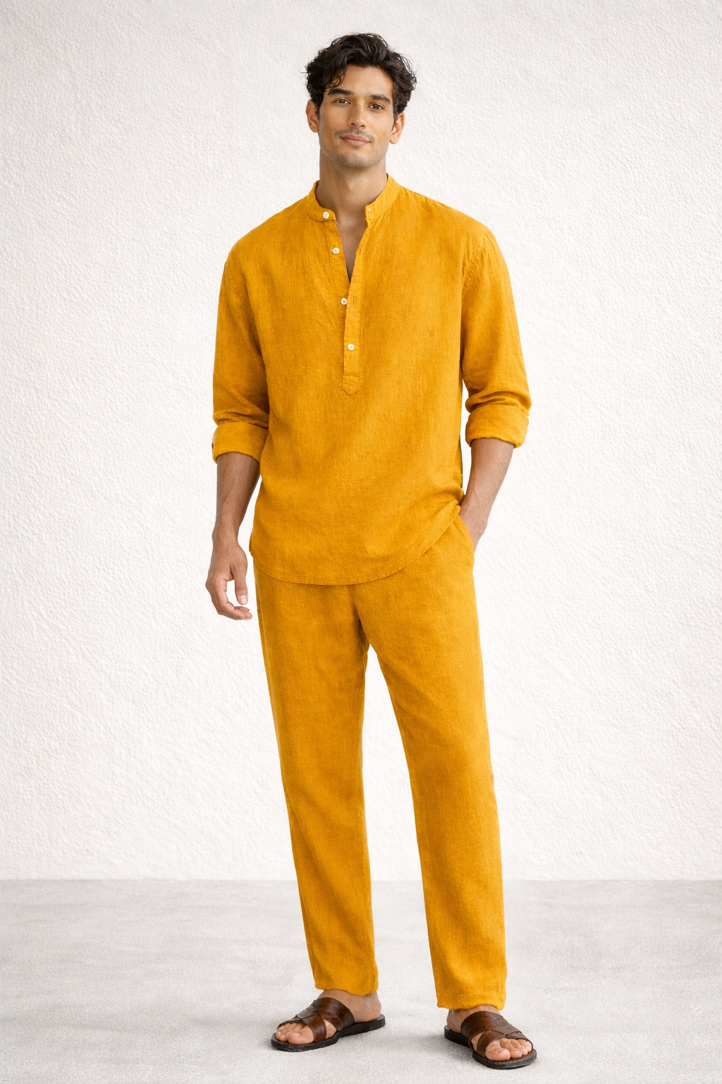 Mustard yellow linen short kurta set for men with hands outside pockets