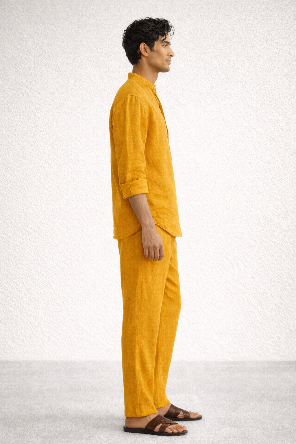 Side view of mustard yellow short kurta linen set for men