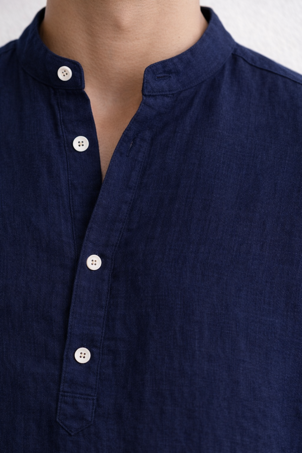 Close-up of pure linen fabric texture in navy blue kurta