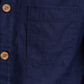 Close-up of navy blue pure linen fabric texture with natural weave and soft creases