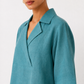 Nivara teal linen top with notched collar and V-neck detail