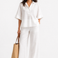 Noor Safa ivory linen set for women styled with woven bag
