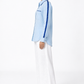 Side view of ocean blue linen shirt with navy satin sleeve detailing