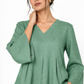 Sadabar sage green linen top close up with V-neck and flared sleeves