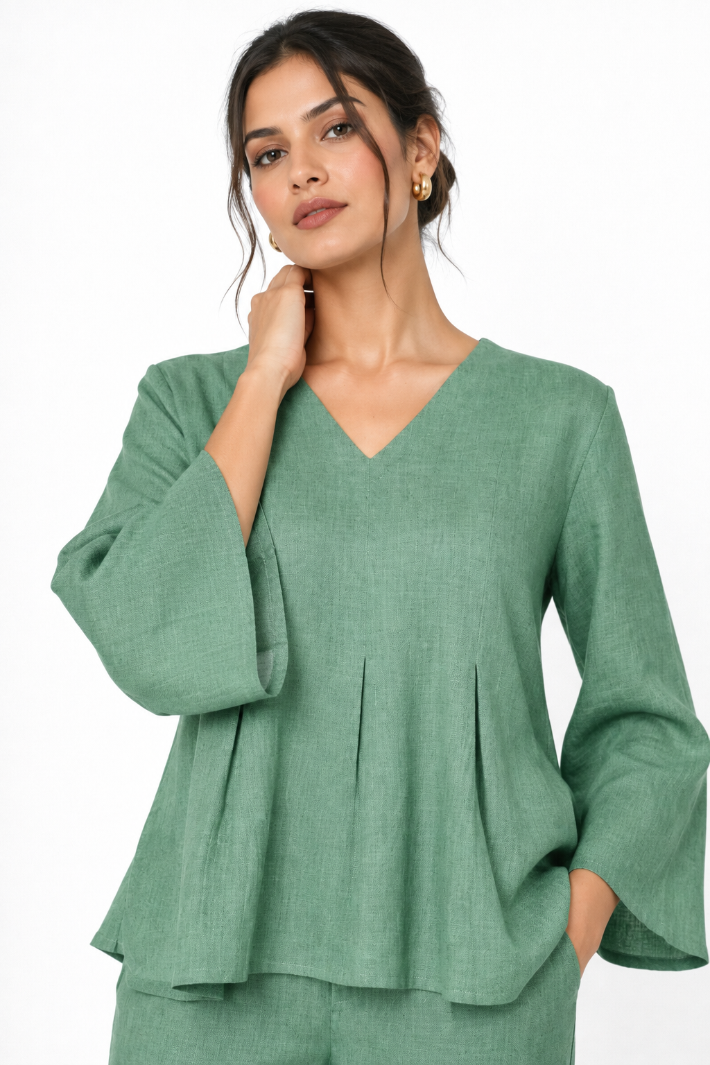 Sadabar sage green linen top close up with V-neck and flared sleeves