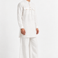 Three-quarter view of the Safed white linen kurta set for men showing its relaxed silhouette and wide-leg trousers.
