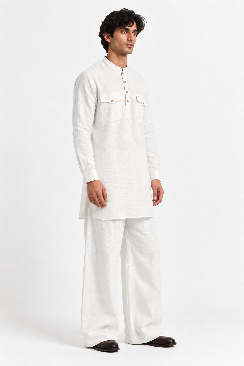 Three-quarter view of the Safed white linen kurta set for men showing its relaxed silhouette and wide-leg trousers.