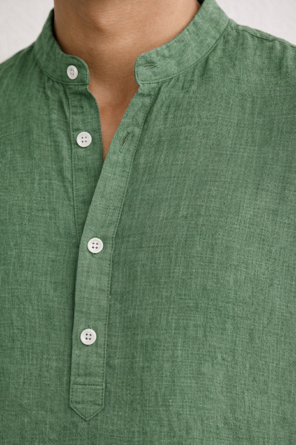 Close up of sage green pure linen fabric short kurta