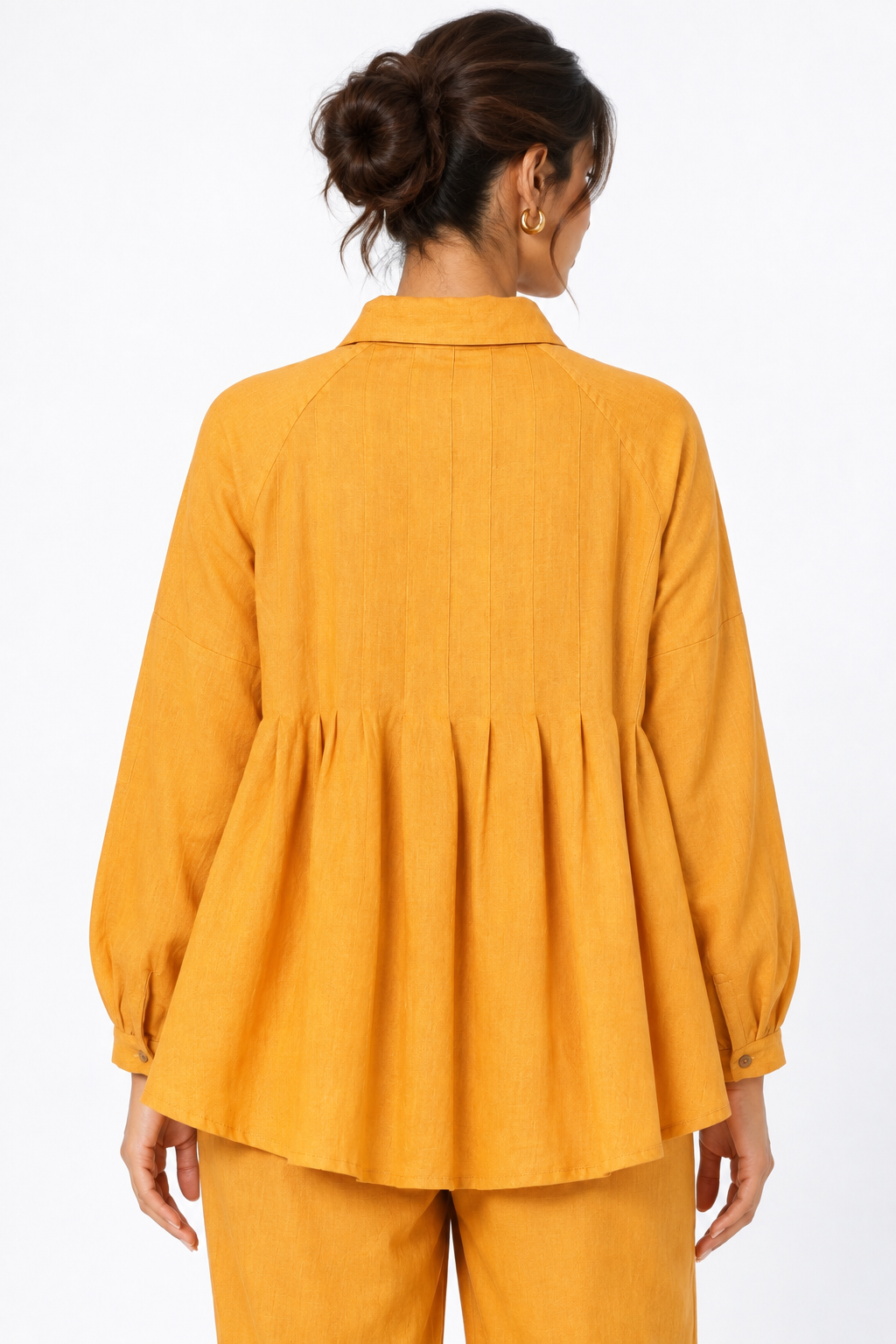Back detail of Sarson women's mustard linen shirt with pleated flare