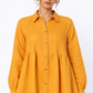 Close-up of Sarson women's mustard linen shirt with collar, buttons and pintuck details