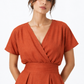 Shahmai terracotta linen dress with V-neck and textured linen fabric