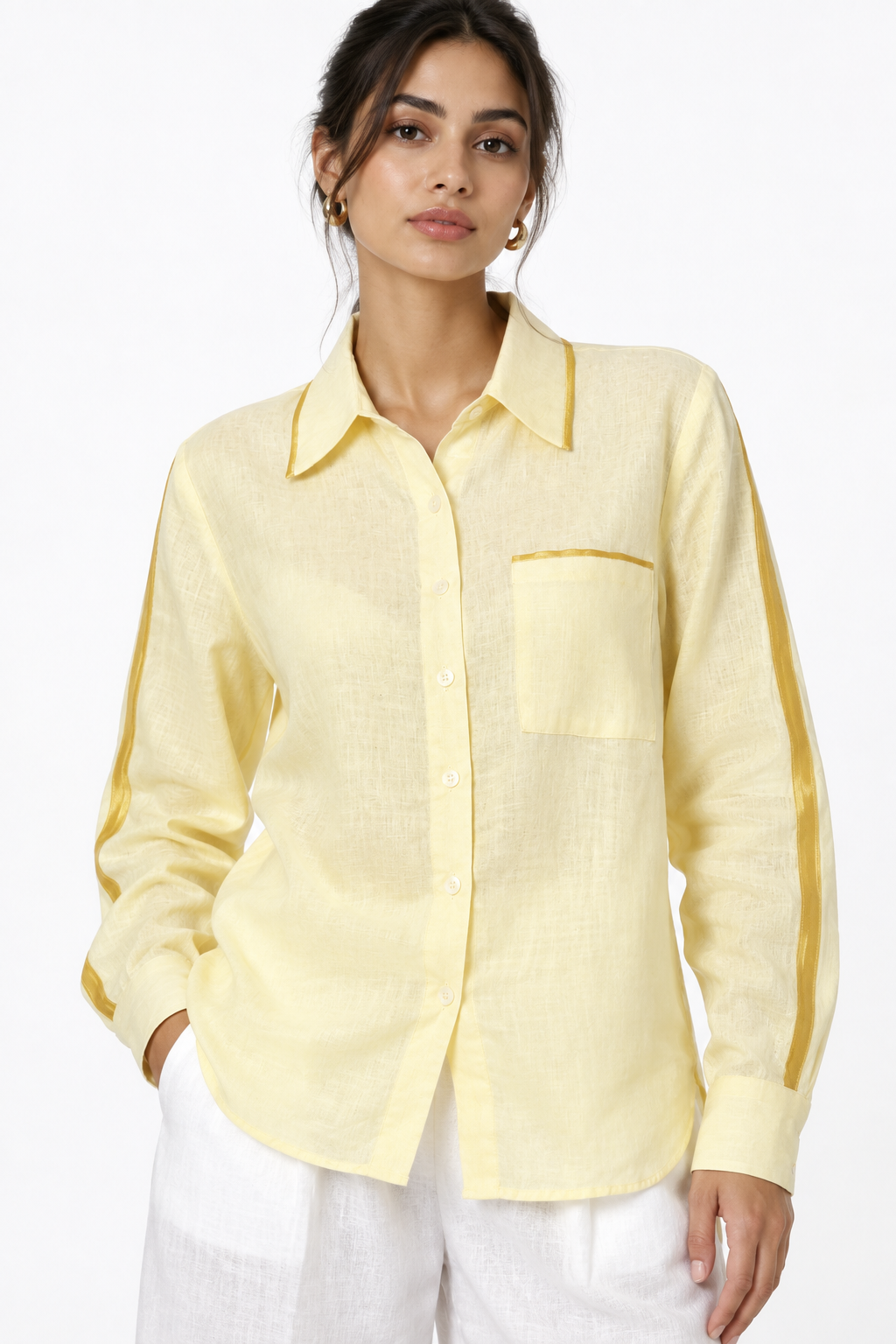 Close-up of sunshine yellow linen shirt with satin collar, pocket and sleeve detailing