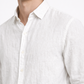Close-up of pure linen fabric texture on white men’s linen shirt