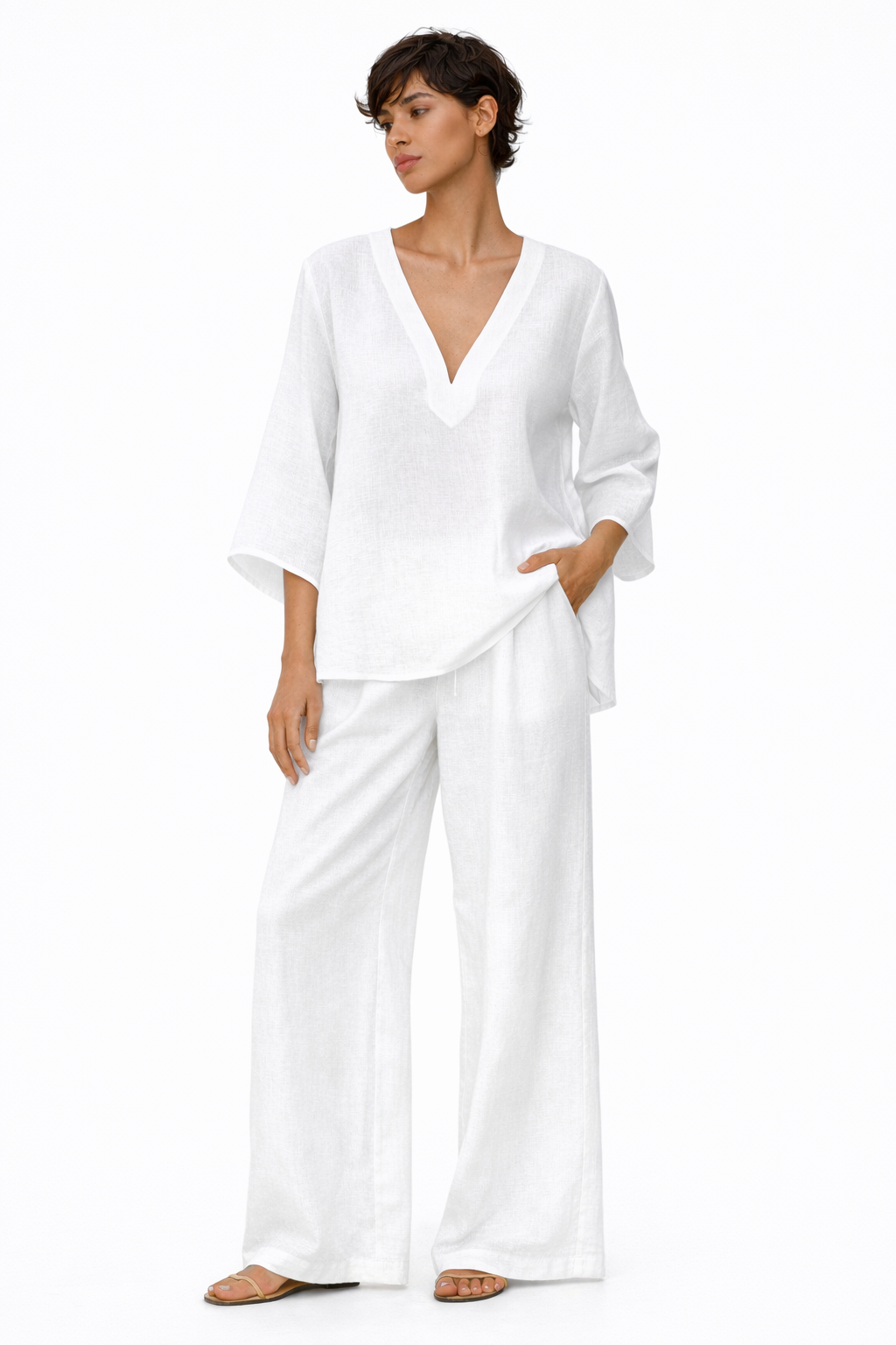 Close-up of side pocket on white linen wide-leg pants, practical and comfortable design.