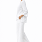 Side view of white linen co-ord set showing flowy silhouette and breathable linen fabric.