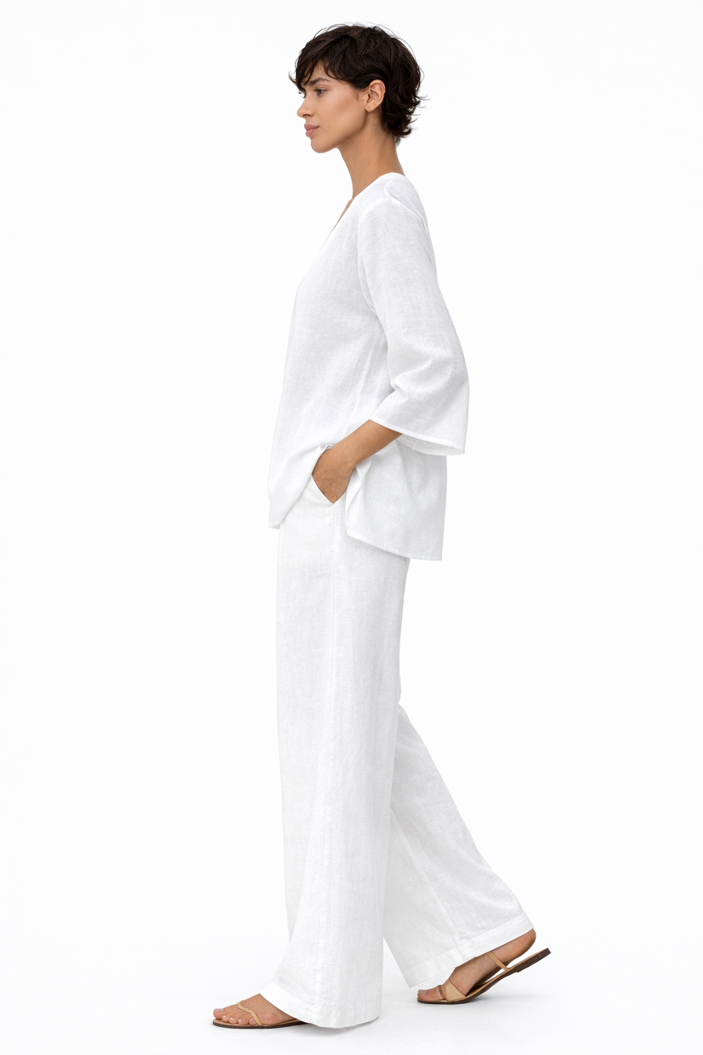 Side view of white linen co-ord set showing flowy silhouette and breathable linen fabric.