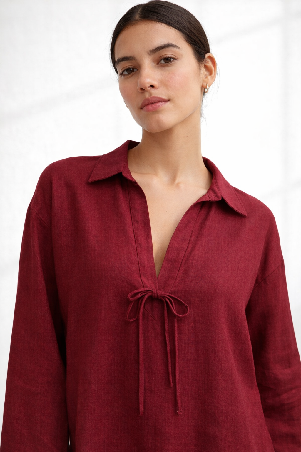 Close-up of Vanya Wine linen top showing tie-up neckline and fabric texture