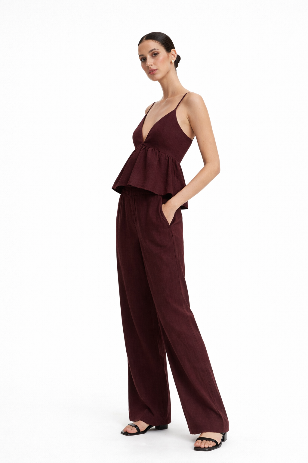Side view of Vera Wine linen set showing peplum top and relaxed fit pants