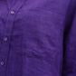 Close-up of linen fabric texture and chest pocket detailing on Violet Muse Linen shirt