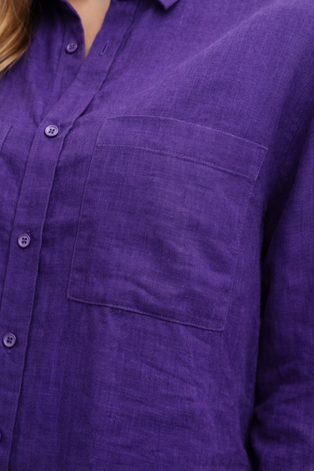 Close-up of linen fabric texture and chest pocket detailing on Violet Muse Linen shirt