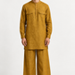 Zafran Linen Set for Men in marigold mustard, featuring a textured kurta and matching wide-leg trousers.