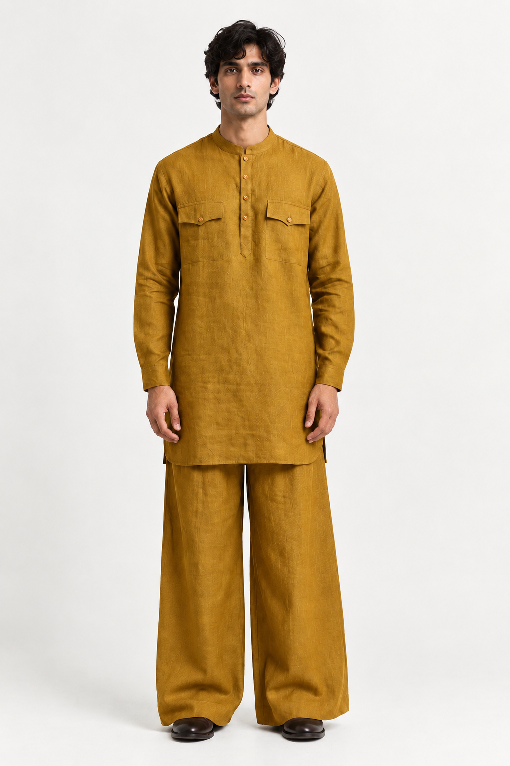 Zafran Linen Set for Men in marigold mustard, featuring a textured kurta and matching wide-leg trousers.
