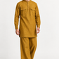 Model wearing the Zafran marigold mustard linen kurta set with a relaxed silhouette and wide-leg trousers.